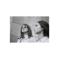 Two women in a high-contrast black and white film portrait shot on Lomography Berlin Kino 400 35mm film.