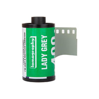 Lomography Lady Grey 400 ISO 35mm black and white film roll with green label and extended film leader.