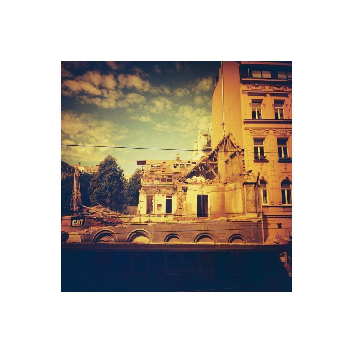 Urban demolition site captured with Lomography Redscale 120 film, featuring dramatic red and orange color shifts.