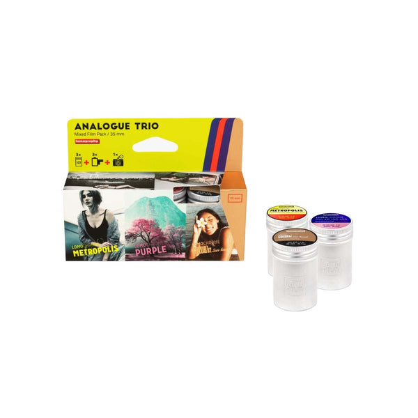 An analogue photo film pack with three clear plastic canisters and a printed retail box. The packaging is bright yellow, orange, and white with sample photos and text including 'ANALOGUE TRIO' and '35 mm'.