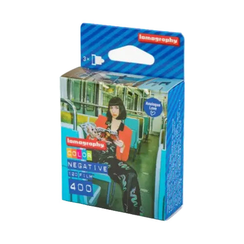 Lamography Color Negative Film 400 120 film box, featuring a blue and white striped design with a graphic of a woman sitting on a subway train.