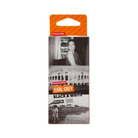 A package of Lomography Earl Grey Black & White 100mm film 35mm film, featuring a white cardboard sleeve with black and white photographic prints and an orange header card.