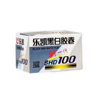 A box of Leika black and white film, model SHD 100, featuring a white and gray design with blue, red, and yellow text and graphics.