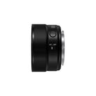 A profile of a black camera lens on a white background