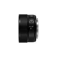 A profile of a black camera lens on a white background