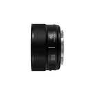 The side of a black camera lens on a white background