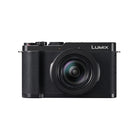 Black camera with the word Lumix on it set on a white background