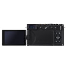 Back side of a black camera with an extended screen on a white background