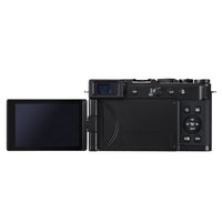 Back side of a black camera with an extended screen on a white background