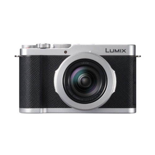 Silver and black camera with the logo name of Lumix on the front on a background