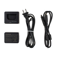 Set of electronic components including a charger, cables, and a power adapter on a white background.
