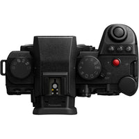 Black camera with various controls on a white background