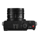 Black Panasonic camera with lens on a white background