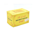 A yellow rectangular box of Secret Sauce, featuring red decorative borders and text in English and Chinese, set against a plain white background.