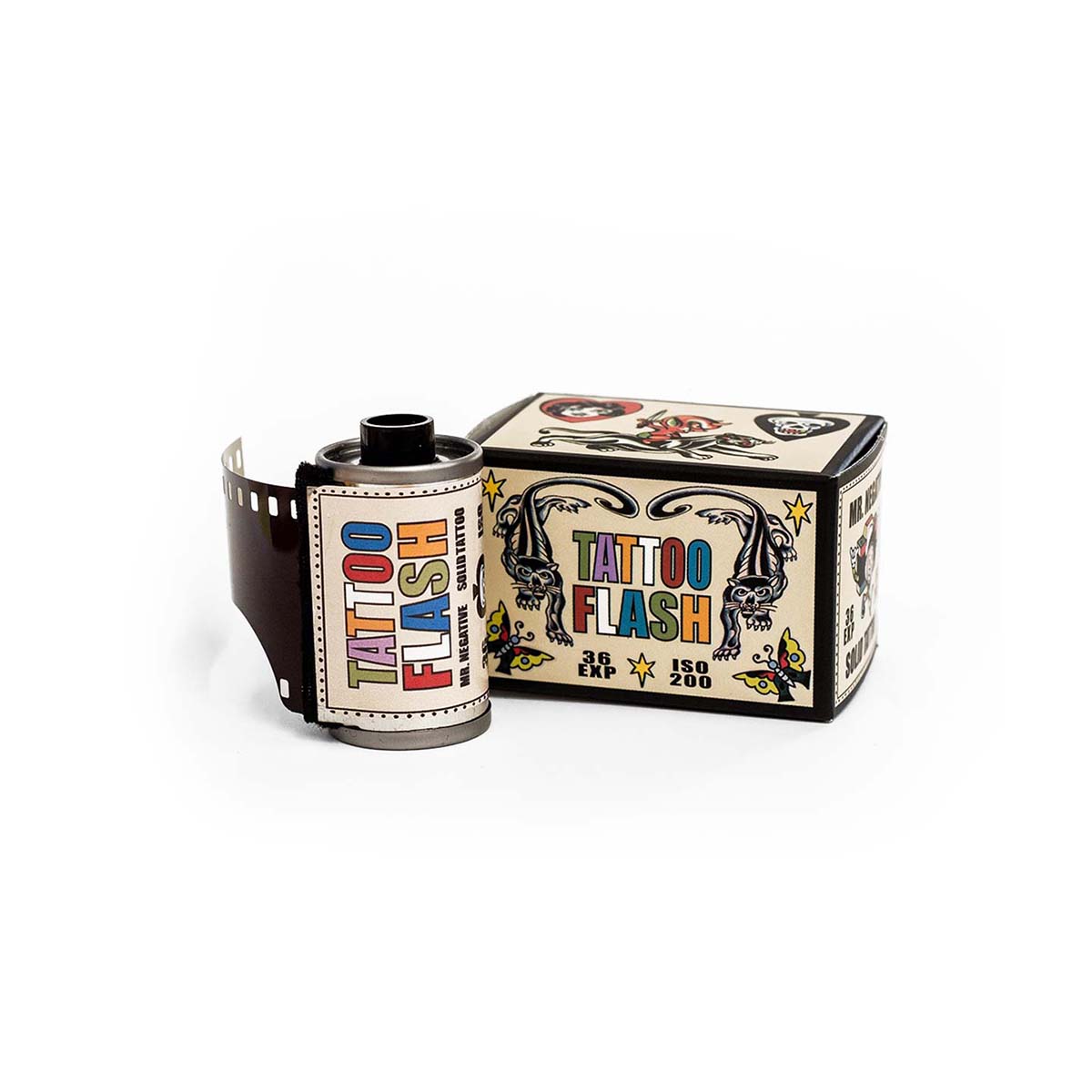 A roll of vintage-style tattoo flash film next to its illustrated cardboard box on a clean white background.