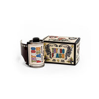 A roll of vintage-style tattoo flash film next to its illustrated cardboard box on a clean white background.