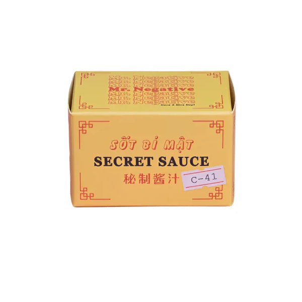 Box of 'Secret Sauce' 35mm film with a yellow background