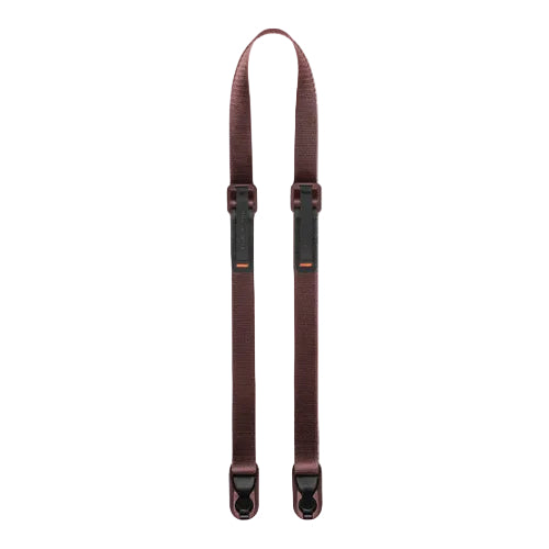 Brown suspenders with black clips on a white background