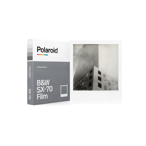 Polaroid B&W SX-70 instant film pack with 8 exposures and a sample square monochrome photo in a classic white frame.