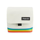 White nylon Polaroid box camera bag featuring a rainbow stripe design, fold-over flap, and black Polaroid logo patch.