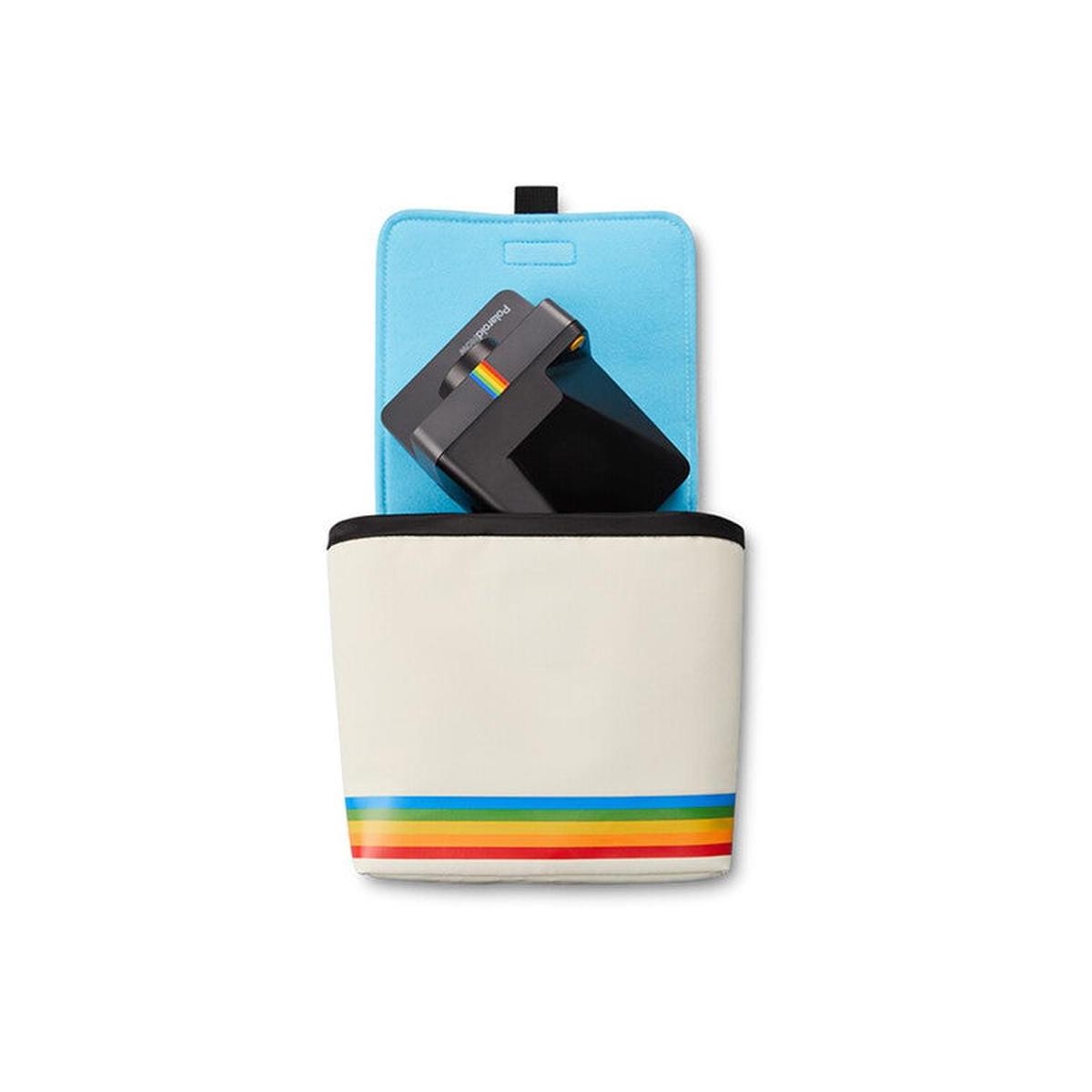 White nylon Polaroid box camera bag with a rainbow stripe, blue fleece interior, and a black camera inside.