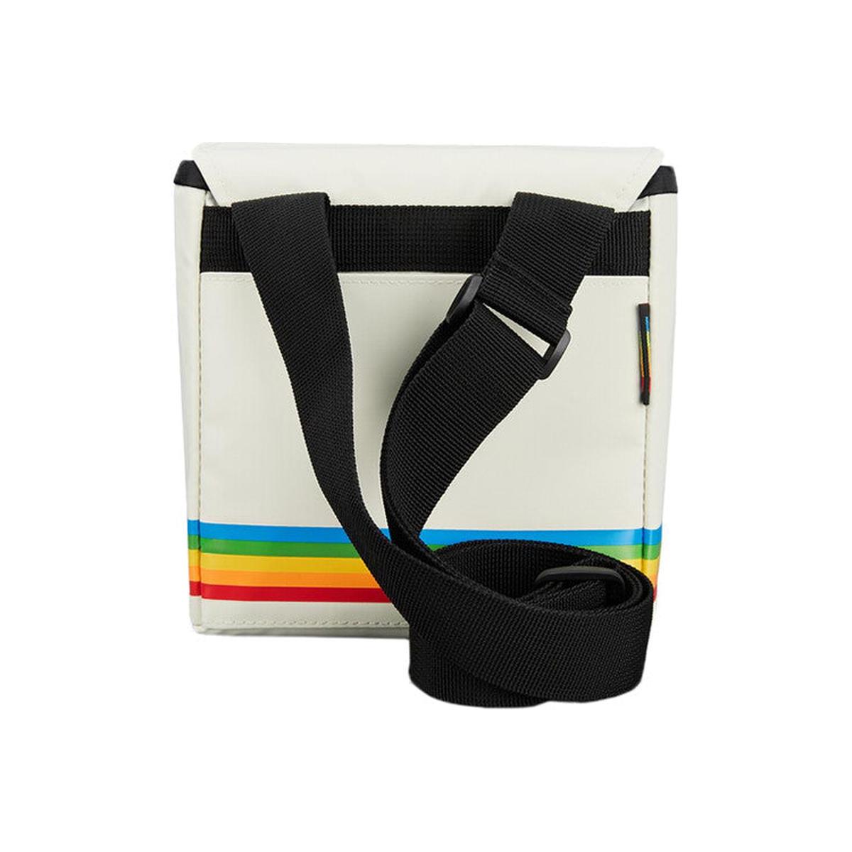 White nylon Polaroid box camera bag with a black adjustable shoulder strap and signature rainbow stripe detail.