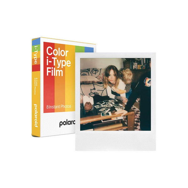 Polaroid Color i-Type film box with 8 exposures and a sample square glossy instant photo of people on a table.
