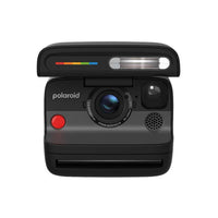 Matte black Polaroid Flip instant camera with a 4-lens autofocus system, built-in flash, and iconic rainbow color stripe.