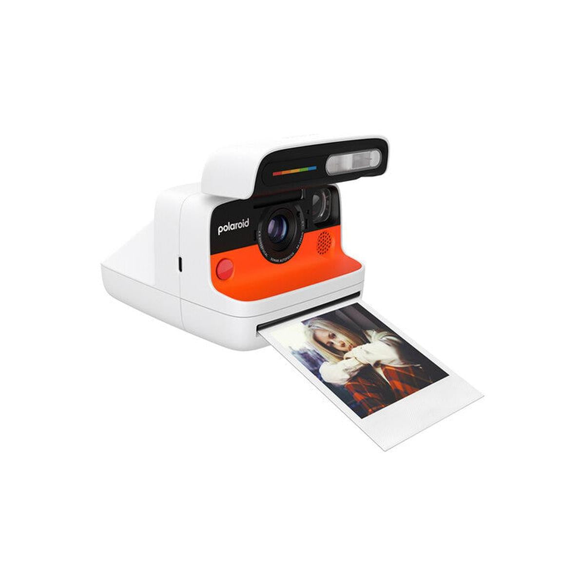 White and orange Polaroid instant camera with a 4-lens autofocus system ejecting a developed film photo.