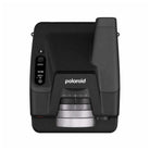Top-down view of a black Polaroid I-2 instant camera featuring a prominent silver lens ring and digital exposure display.