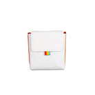 White polyester Polaroid camera bag with orange sides, a foldover flap, and a small rainbow brand tag.