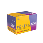 A box of Kodak Portra 800 film, with the brand and film speed (135/800) visible. The box is predominantly yellow and purple with text and branding.