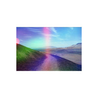 Landscape shot on 35mm film with holographic rainbow light leaks over a grassy hill and desert valley.