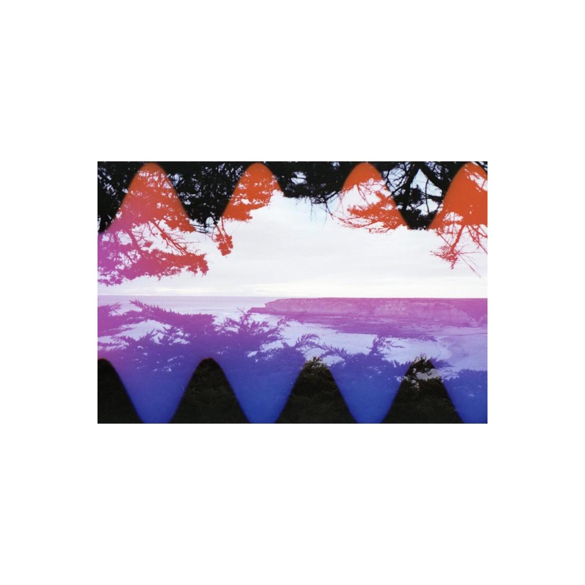 Coastal landscape shot on 35mm film with vibrant orange and blue wave-pattern color effects overlaying the frame.