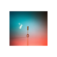 Revolog Kolor 200 film shot of a thin antenna against a sky with vibrant turquoise and orange color gradient washes.