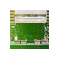 Street newsstand in Italy with a vibrant green color wash effect from Revolog Kolor 35mm film.