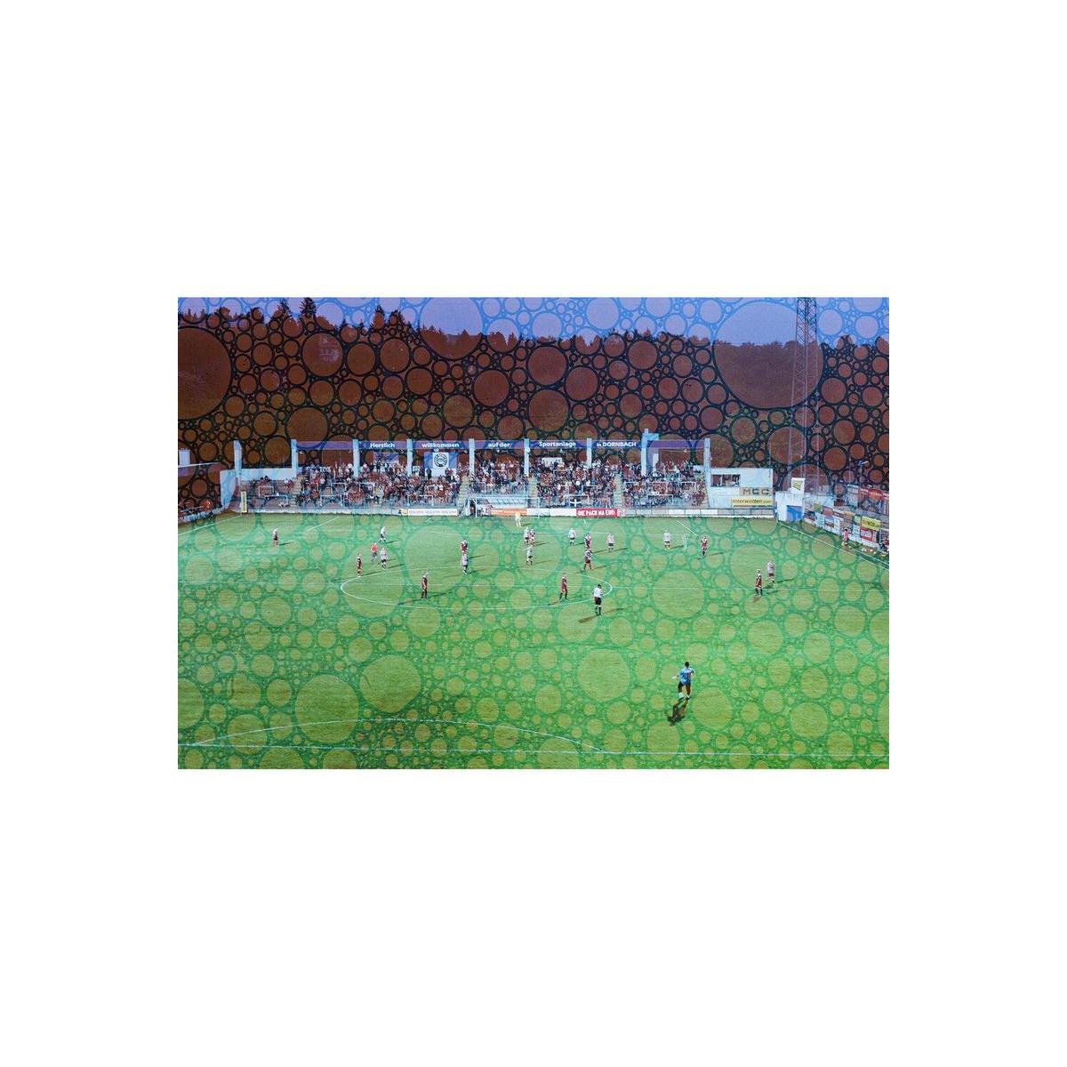 Soccer match on a green field overlaid with Revolog Texture film's signature bubble-like pattern effect.
