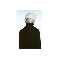 Portrait of a person wearing a white headwrap, featuring the Revolog Texture film's signature bubble pattern effect.