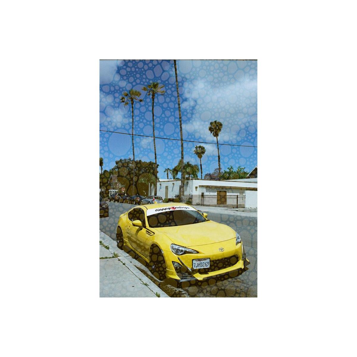 Yellow sports car parked on a street with palm trees, overlaid with Revolog Texture 35mm film's bubble effect.