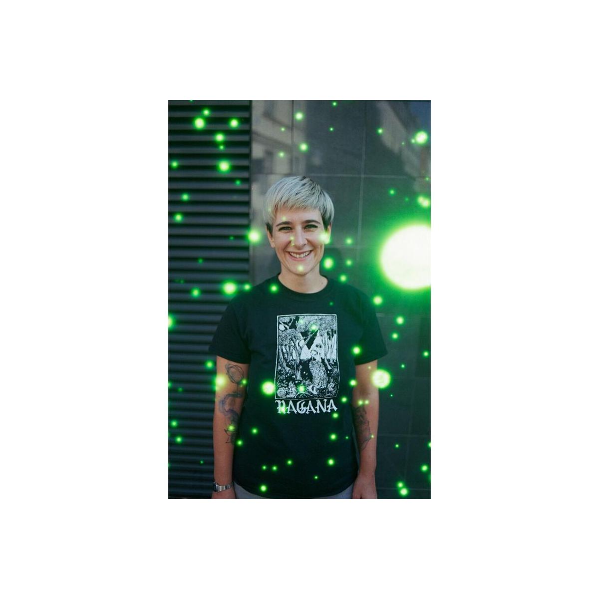 Portrait of a person wearing a black t-shirt, overlaid with glowing green orb effects from REVOLOG Volvox 35mm film.