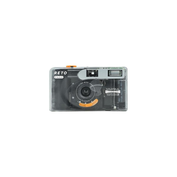 Reto PANO 35mm film camera in a compact, clear plastic body with a 22mm wide-angle lens and manual controls.