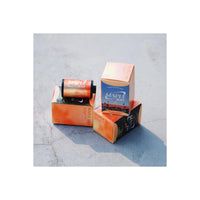 Two cartons with 'Maple 100' branding on a concrete surface
