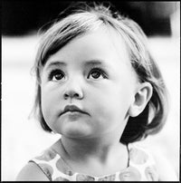 Black and white photo of a young girl looking to the side
