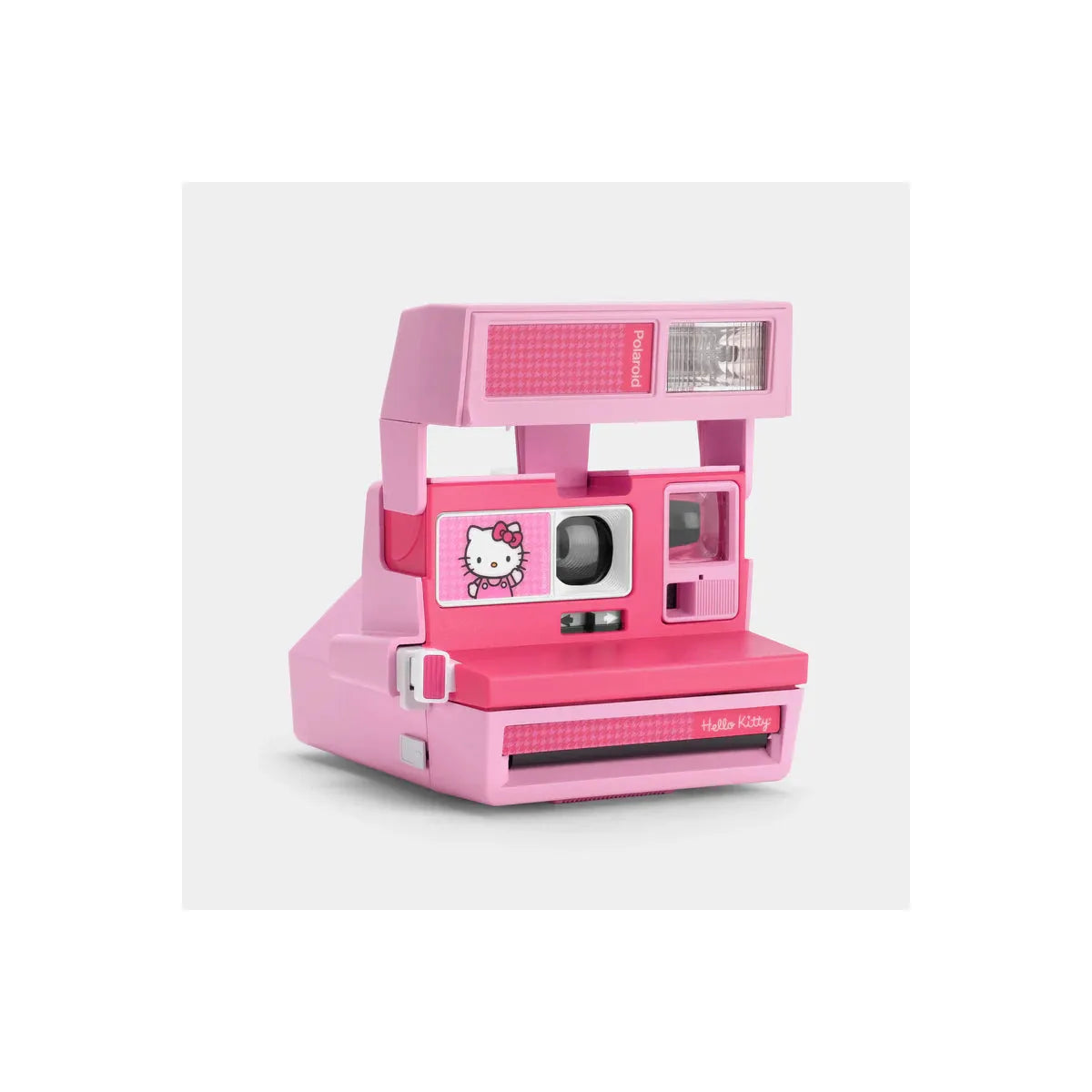 Pink Retrospekt Polaroid 600 instant camera featuring a Hello Kitty graphic and a classic boxy design.