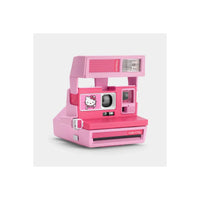 Pink Retrospekt Polaroid 600 instant camera featuring a Hello Kitty graphic and a classic boxy design.