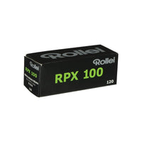 Black Rollei RPX 100 ISO 120 medium format film box with green text on a white background.