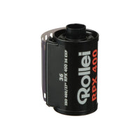 Black Rollei RPX 400 35mm film canister with white and red text, showing 36 exposures and ISO 400 rating.