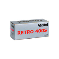 Rollei Retro 400S 120 black and white film box in silver packaging with bold red and black text.