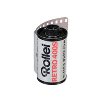 Rollei Retro 400S 35mm black and white film canister with a silver and black label, showing 36 exposures.