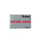 Silver box of Rollei Retro 400S 35mm black and white film with red text and 135-36 exposure count on a white background.